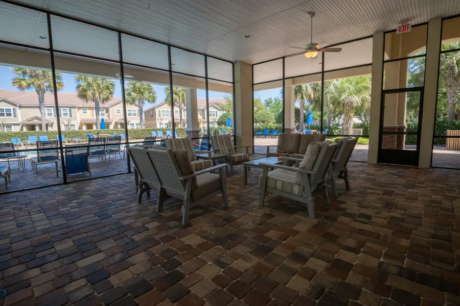 Screened clubhouse lounge overlooking the pool